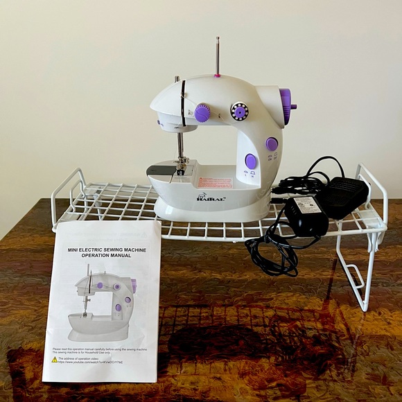Other - Mini electric sewing machine operation manual. Like new, little used.